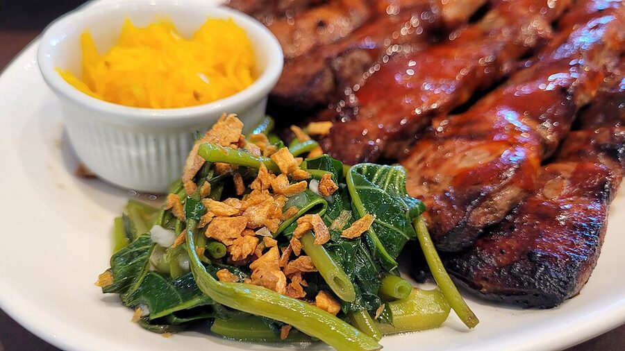 Inihaw na baboy (grilled pork) with atchara on a plate