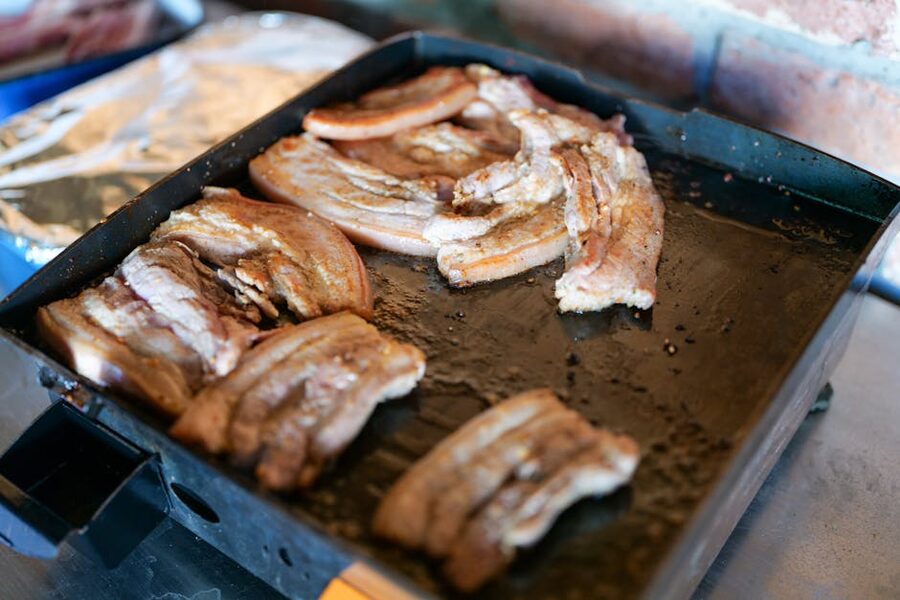 Sliced roasted pork belly with crisp skin on a plate