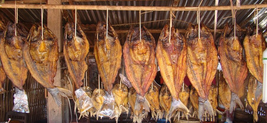 Dried fish stacked at market stall
