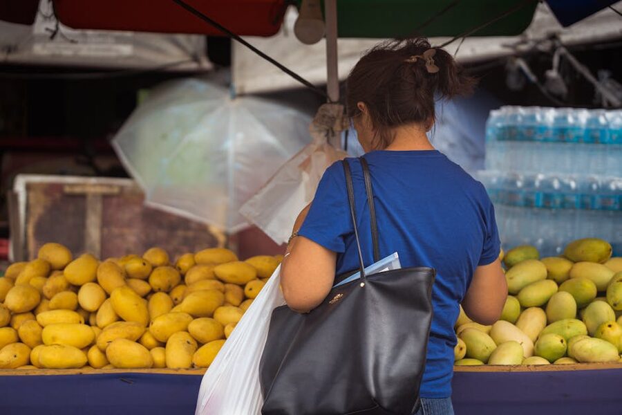 Woman shopping for mangoes at Cebu City market