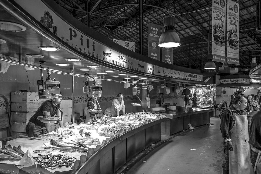 Fish vendor displaying his catch at a market